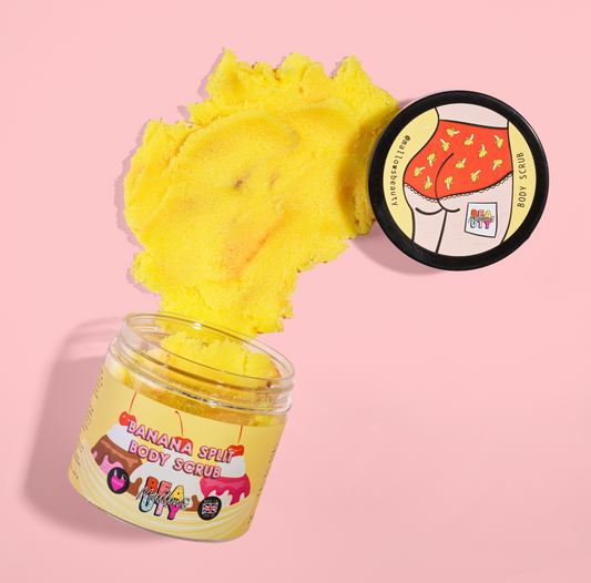 Banana split themed body scrub with a yellow scrub texture on a pink background